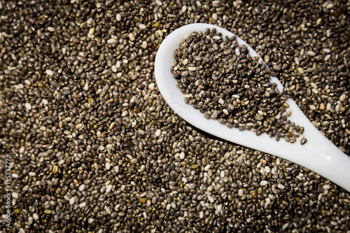 Chia seeds with ceramic white spoon