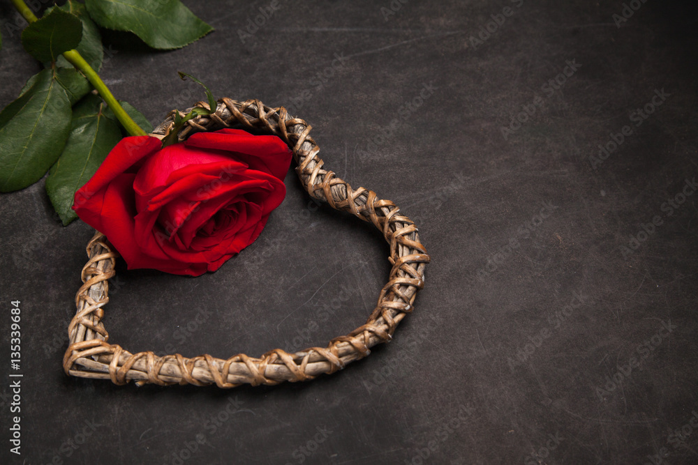 Red rose on dark background with wooden heart shaped, concept of romantic relationship. Congratulation on Valentine's day. Red rose on dark background with wooden heart shaped, concept of romantic relationship. Congratulation on Valentine's day.