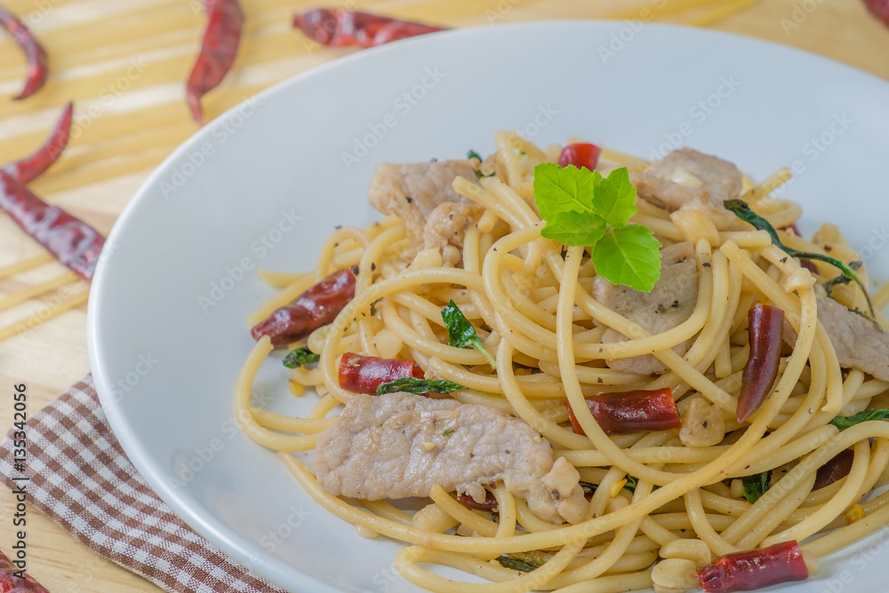 Spicy spagetti with stir-fried pork , dried chilli and basil : Thailand style food Spicy spagetti with stir-fried pork , dried chilli and basil : Thailand style food