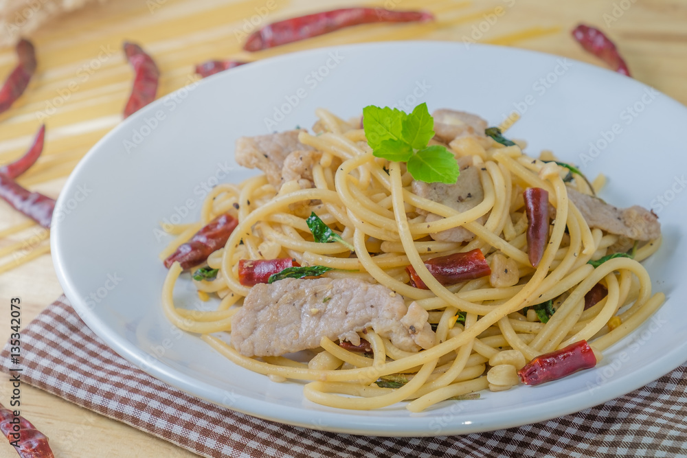 Spicy spagetti with stir-fried pork , dried chilli and basil : Thailand style food