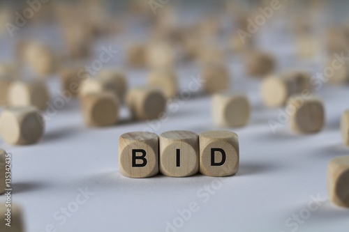 bid - cube with letters, sign with wooden cubes