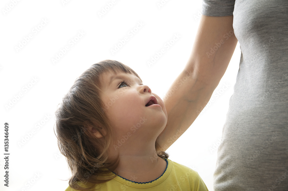 Little girl looking up at mother,trusting relationship concept Little girl looking up at mother,trusting relationship concept