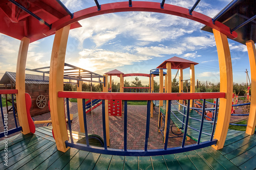 Photography Color children's playground with a sunset sky