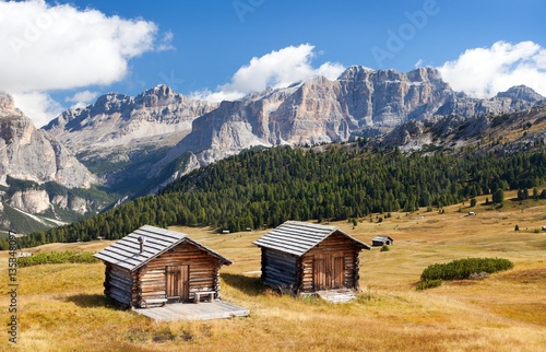 wooden small cabin in dolomities alps mountains