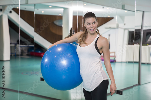 Woman at the gym with a pilates ball © BGStock72