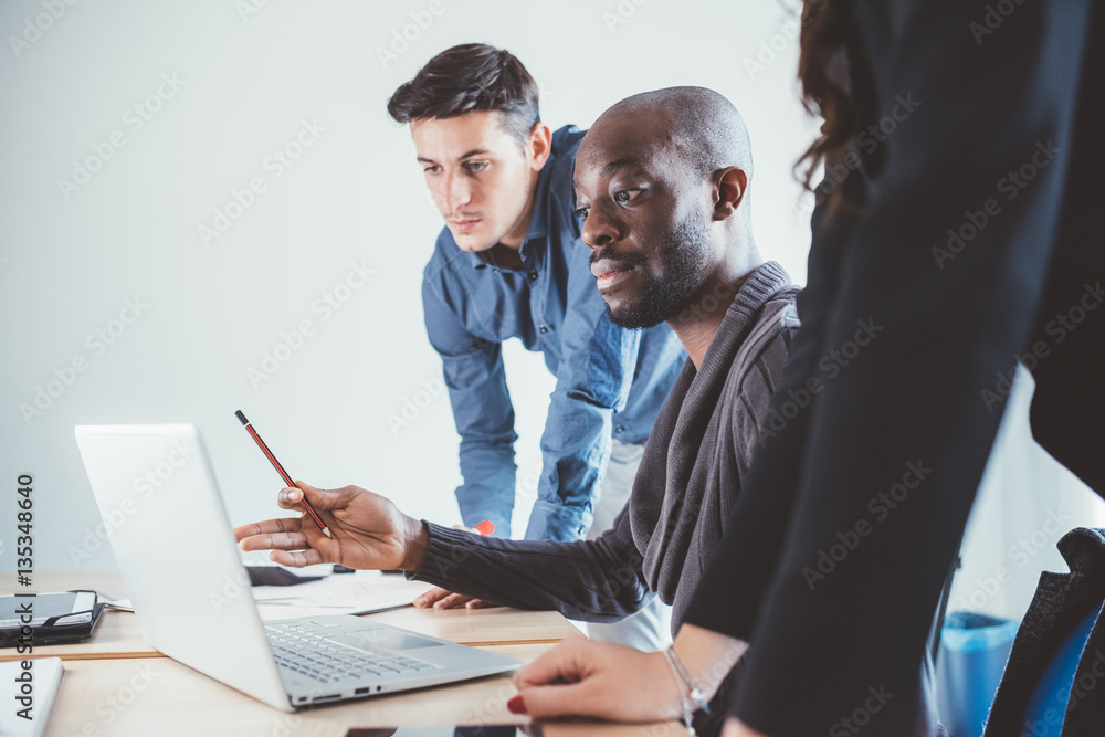 Fototapeta premium Multiracial business people working together connected with technological devices like tablet and notebook - teamwork, business, working concept