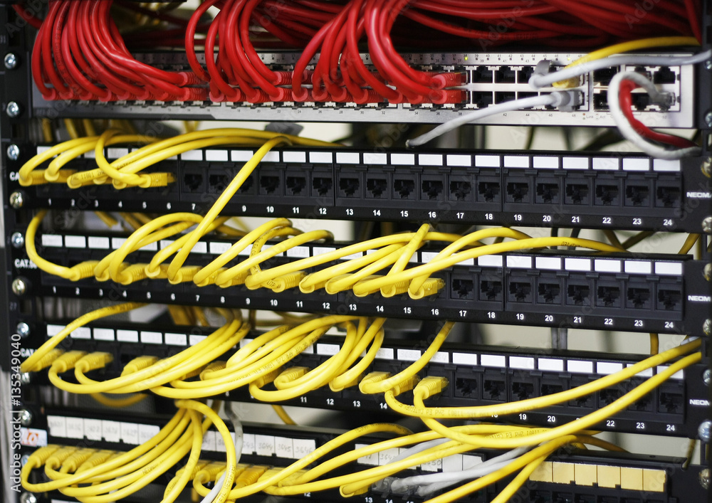 Network panel, switch and cable in data center, ethernet cables, server rack.  Stock Photo | Adobe Stock
