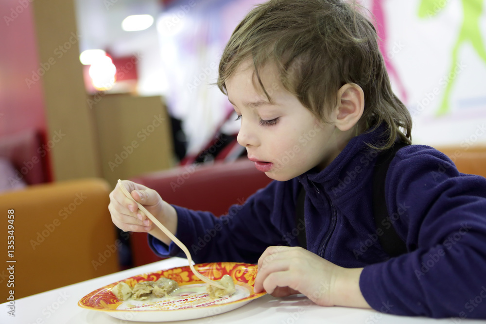 Child eating pancake Child eating pancake