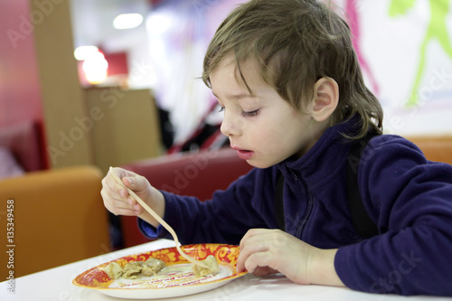 Child eating pancake