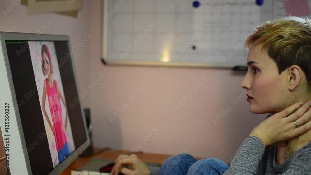 Girl photographer selects photos on the computer with his shooting. Woman removes not a great shot. Girl photographer selects photos on the computer with his shooting. Woman removes not a great shot.