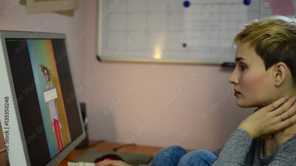 Girl photographer selects photos on the computer with his shooting. Woman removes not a great shot. Girl photographer selects photos on the computer with his shooting. Woman removes not a great shot.