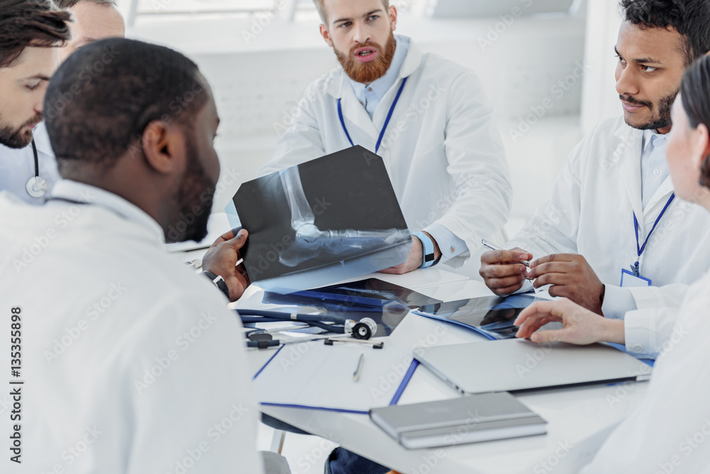 Confident doctors having conversation at hospital Confident doctors having conversation at hospital