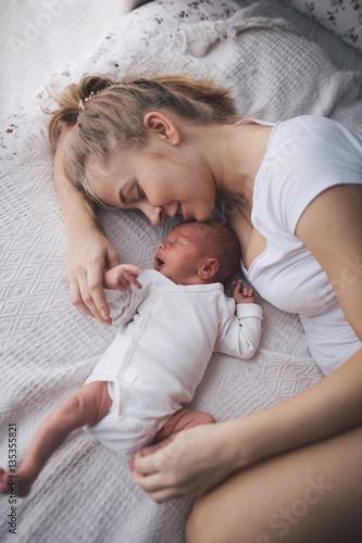 Принти на полотні Portrait of mother and her newborn baby.