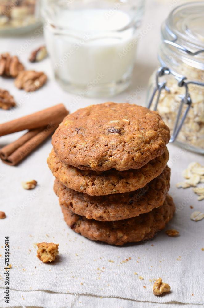 Homemade Oatmeal Cookies with Walnut and Cinnamon on bright background Homemade Oatmeal Cookies with Walnut and Cinnamon on bright background