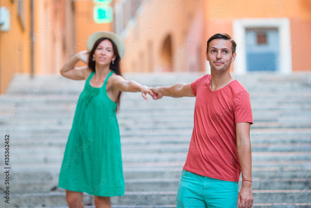 Romantic couple holding hands on Steps in Rome enjoy italian holidays.