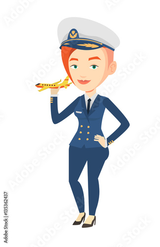 Cheerful airline pilot with model airplane.