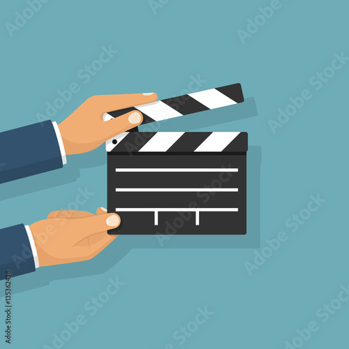 Movie clapper board hold in hand