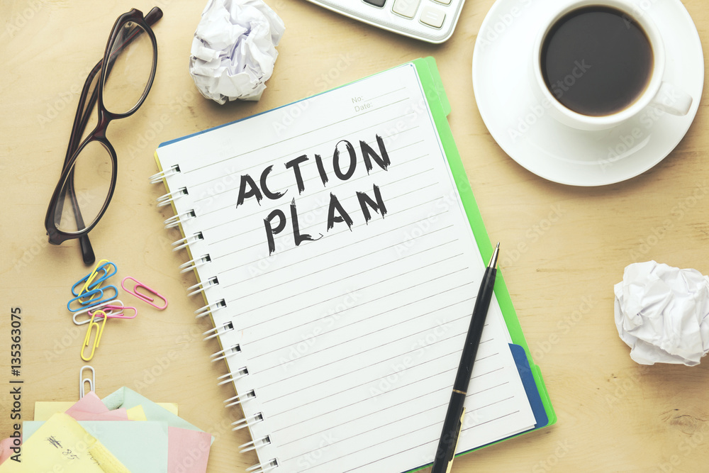 Action plan text written on notebook Action plan text written on notebook