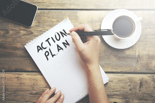 Woman write action plan text photo