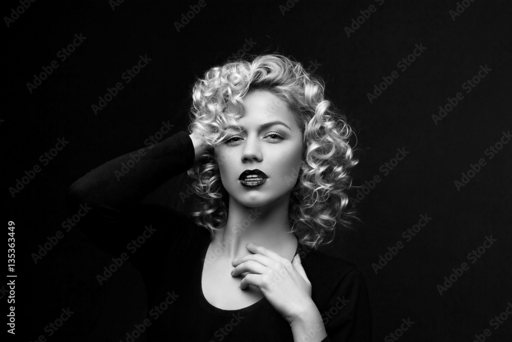 Portrait of a attractive woman with blonde curly hair