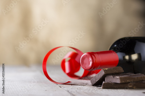 chocolate and bottle of red vine with red ribbon .valentines day