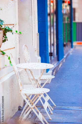 Two blue chairs on a street of italian traditional village in Italy © travnikovstudio