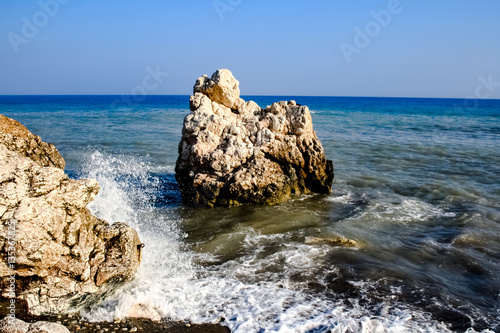A stone in the sea, where the waves break on the beach near the rock of Aphrodite./Stone on the beach./ Petra tou Romiu.Cyprus  beach photo