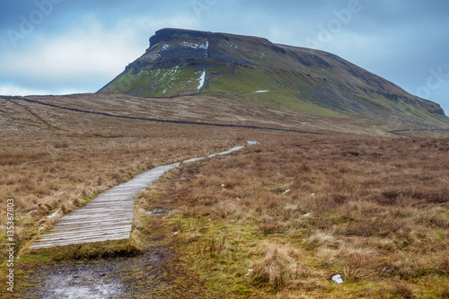 Pen-y-ghent or Penyghent is a fell in the Yorkshire Dales. It is one of the Yorkshire Three Peaks photo