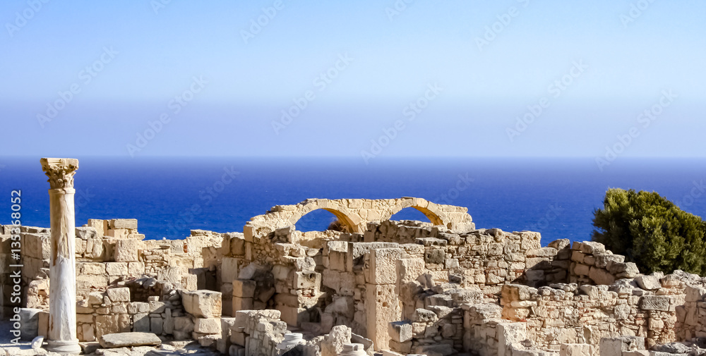 Beautiful scenery of the ruins of arches on a rock by the sea. / Ruins by the sea / Curion, Cyprus