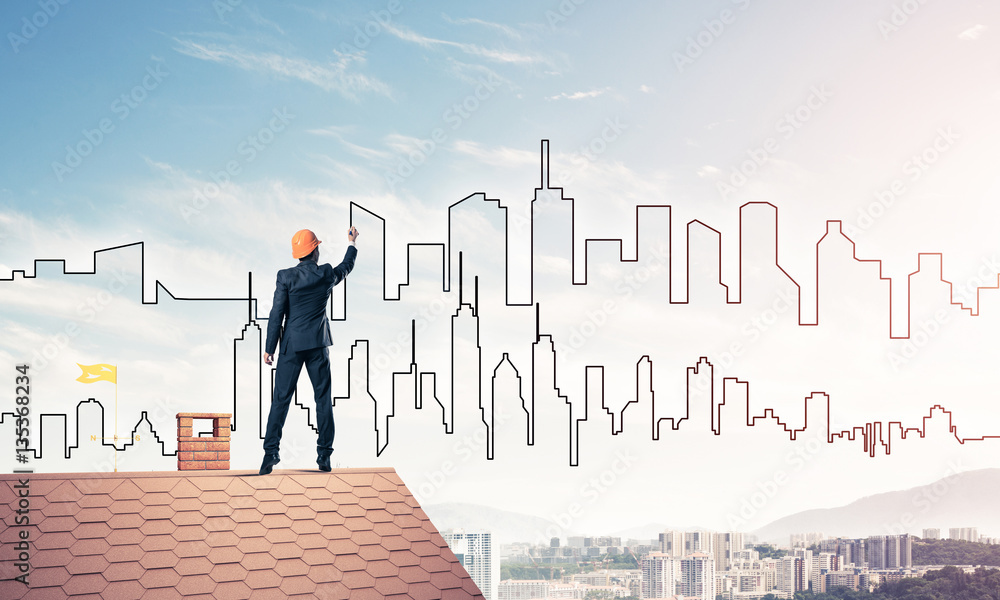 Man architect draw silhouette of modern city on blue sky. Mixed Man architect draw silhouette of modern city on blue sky. Mixed