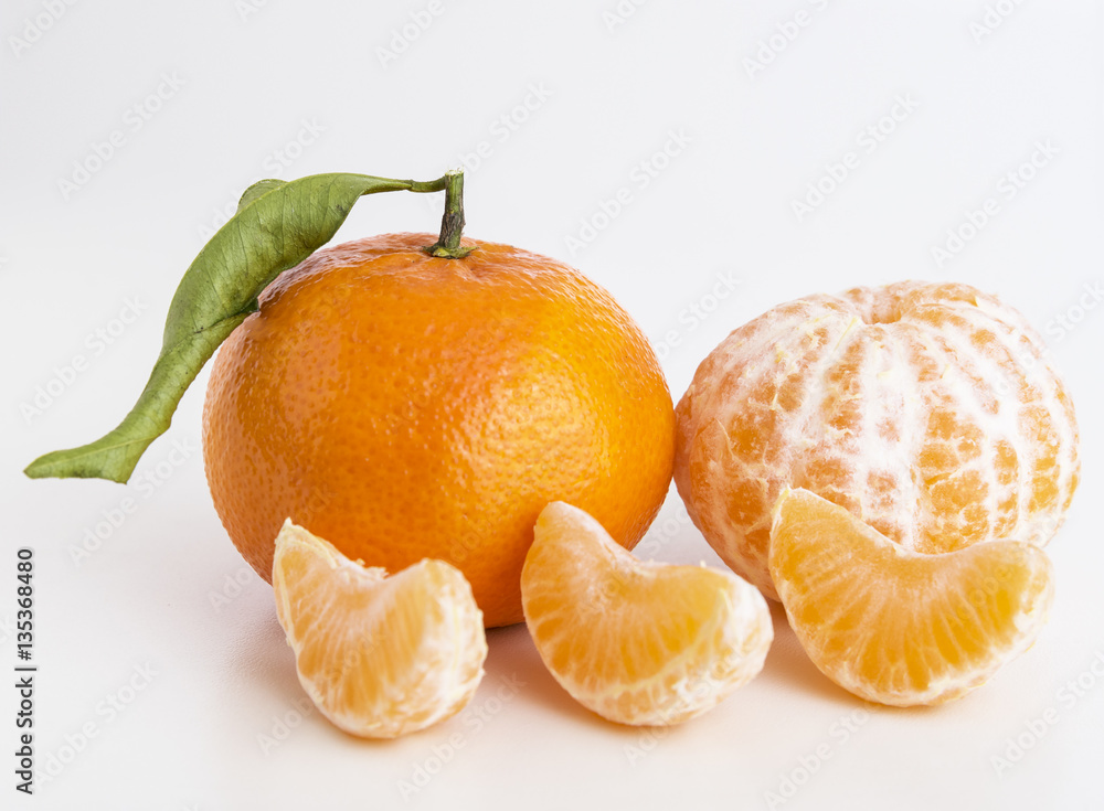 Collection of whole tangerine or clementine fruits and peeled segments isolated on white background Collection of whole tangerine or clementine fruits and peeled segments isolated on white background