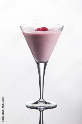 Wallpaper Mural Raspberry vodka cocktail with cranberry juice, vanilla ice cream and raspberries. On white background with reflection. Torontodigital.ca