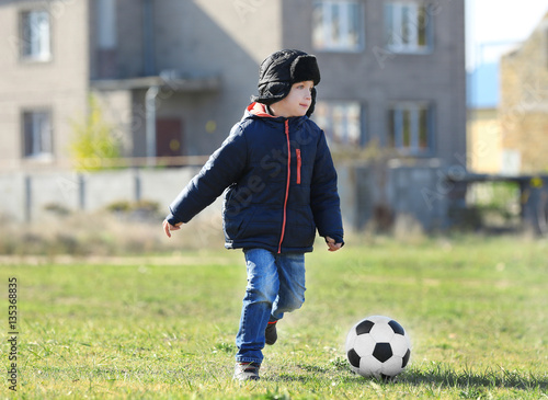 Cute little boy playing foo...