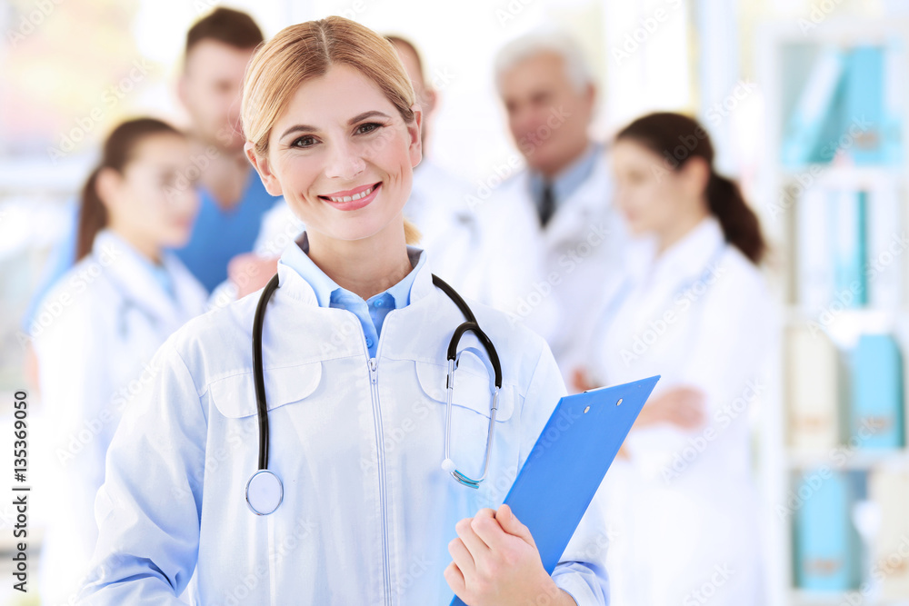 Fototapeta premium Young beautiful doctor in clinic