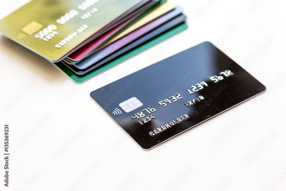 pile of credit cards on white background pile of credit cards on white background