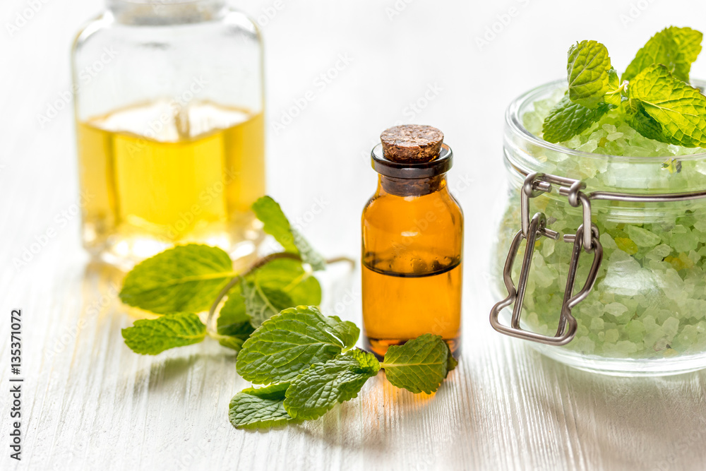 organic cosmetics with herbal extracts of mint on wooden background organic cosmetics with herbal extracts of mint on wooden background