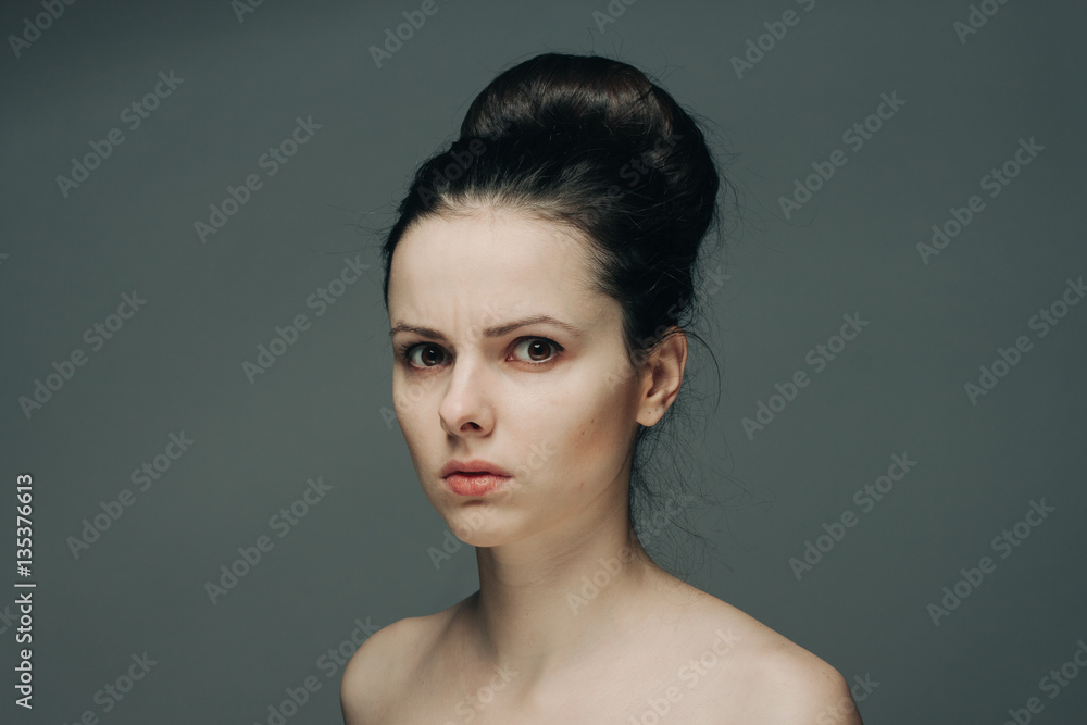 gray background and attractive woman with hairdo gray background and attractive woman with hairdo