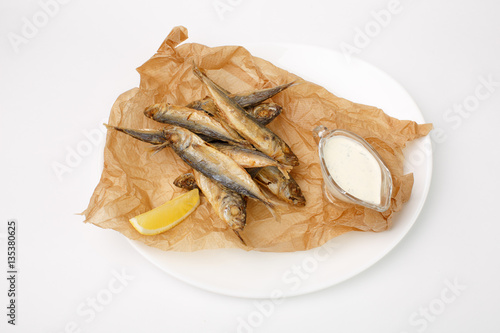 grilled fish with vegetables on a white background