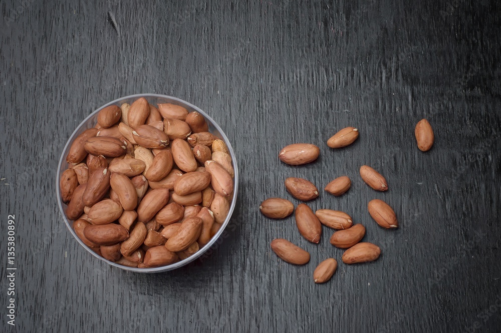Peanuts on wooden table background Peanuts on wooden table background