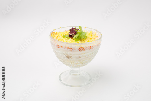 salad "Mimosa" on a white background