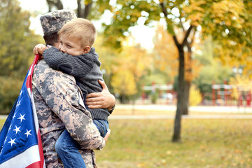 Soldier reunited with his family on a sunny day