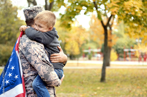 Soldier reunited with his family on a sunny day