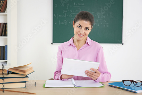 Young beautiful teacher in ...