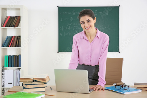 Young beautiful teacher in ...
