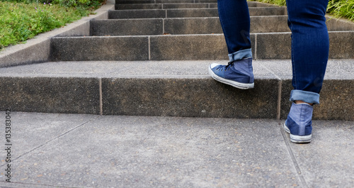 Close up of a female legs walking up stairs