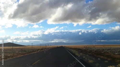 Driving desert road on route 95, on a november evening, near lunar crater, in Nevada, United states of America photo