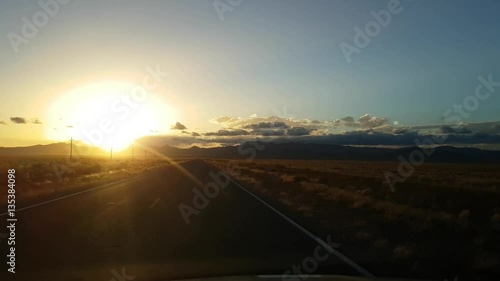 Driving on a desert road on route 95, on a november evening, near Tonopah, in Nevada, United states of America photo