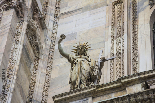  Italy, statue on the Milan Duomo facade, representing the New Law carved by Camillo Pacetti in 1810 inspired Frederic Auguste Bartholdi for the construction of the Statue Of Liberty in NYC photo
