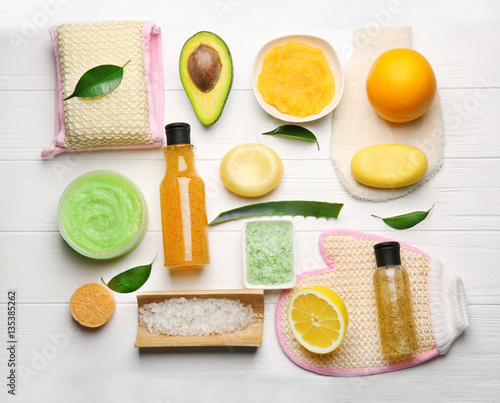 Body care set for peeling on wooden background