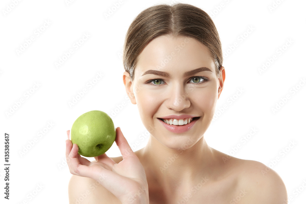 Beautiful young woman holding apple on white background Beautiful young woman holding apple on white background